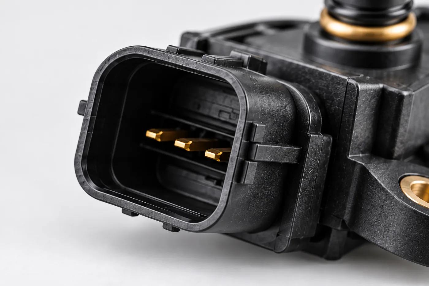 Close-up of a sensor connector and its three pins